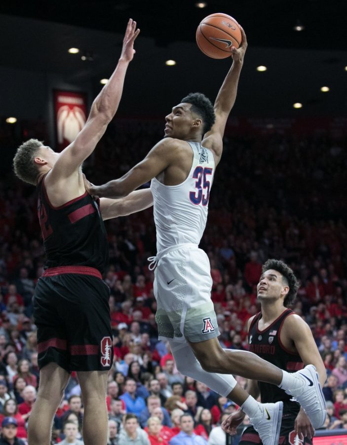 Arizonas+Allonzo+Trier+%2835%29+goes+to+dunk+over+Stanfords+Reid+Travis+%2822%29+during+the+second+half+of+the+Arizona-Stanford+game+on+Thursday%2C+March+1+at+McKale+Center+in+Tucson%2C+Ariz.+Trier+had+18+points+and+four+assists+to+end+the+night.