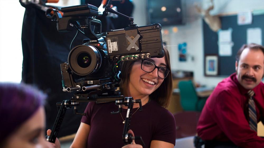 Christina Close, a senior studying Film and TV, behind the camera during the production of her final thesis project. She wants to pursue underwater cinematography to support marine animal conservation. 