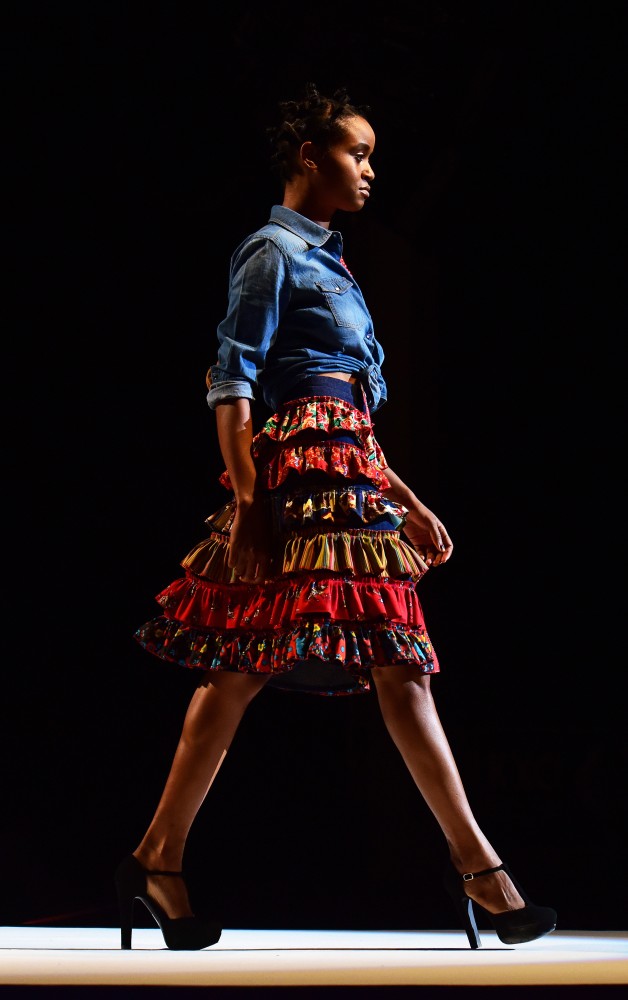 A model in clothing by EstŽban Osuna struts during the first night of Tucson Fashion Week at the Rialto Theatre on Thursday, Oct. 13, 2016. 