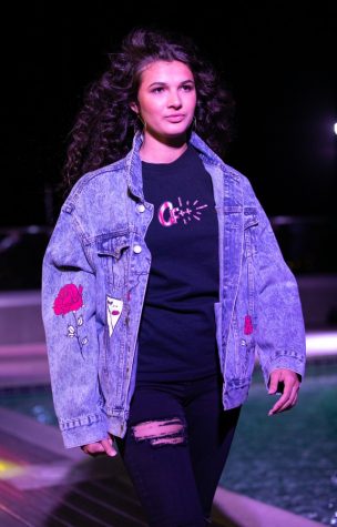 A design by AlwaysLiveCarefree is shown during the UA Fashion Week runway show around the Luna rooftop pool on Saturday, April 28.