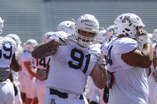 Arizona's Finton Connolly gives two peace signs at the UA scrimmage during the spring football scrimmage on April 7 at Arizona Stadium.