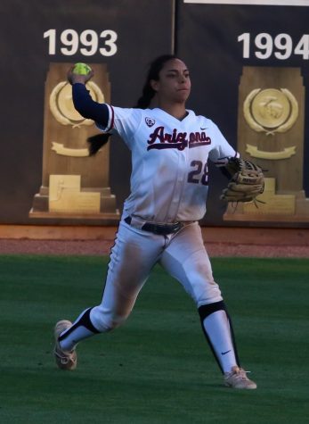 Arizona's Ashleigh Hughes throws the ball from the outfield to her teammates in the Arizona-New Mexico State game at the Rita Hillenbrand Memorial Stadium on Wednesday April 18 in Tucson Ariz.