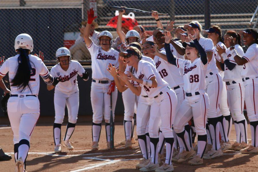 Arizona Wildcats cheer on Alyssa Palomino (32) after hitting a home-run during the Arizona-New Mexico State game at the Rita Hillenbrand Memorial Stadium on Wednesday April 18 in Tucson Ariz.