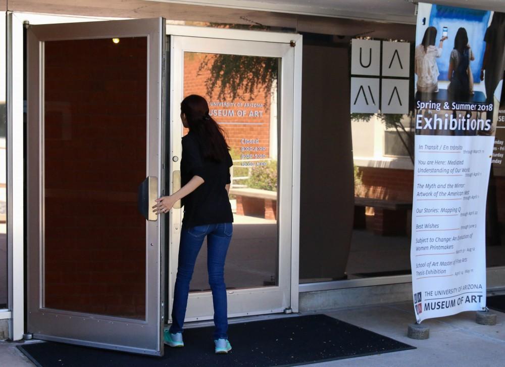 A worker at the University of Arizona Museum of Art enters the museum located off of Speedway and Park Avenue.