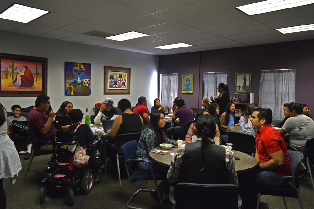 Students gather together to have dinner at the Native American Student Affairs room in the Robert L. Nugent Building on April 27, 2018.