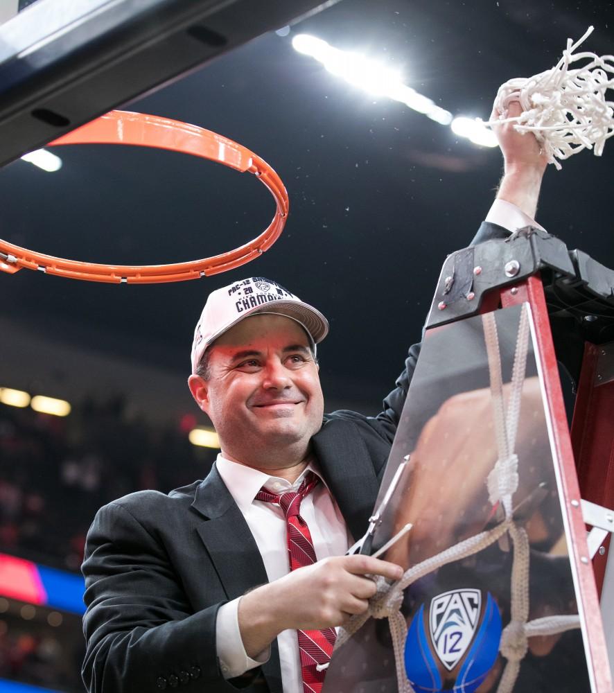 Arizona men's basketball head coach Sean Miller smiles as he cuts down the net after the Arizona victory over USC Championship game at the 2018 Pac-12 Tournament on Saturday, March 10 in T-Mobile Arena in Las Vegas, Nev.