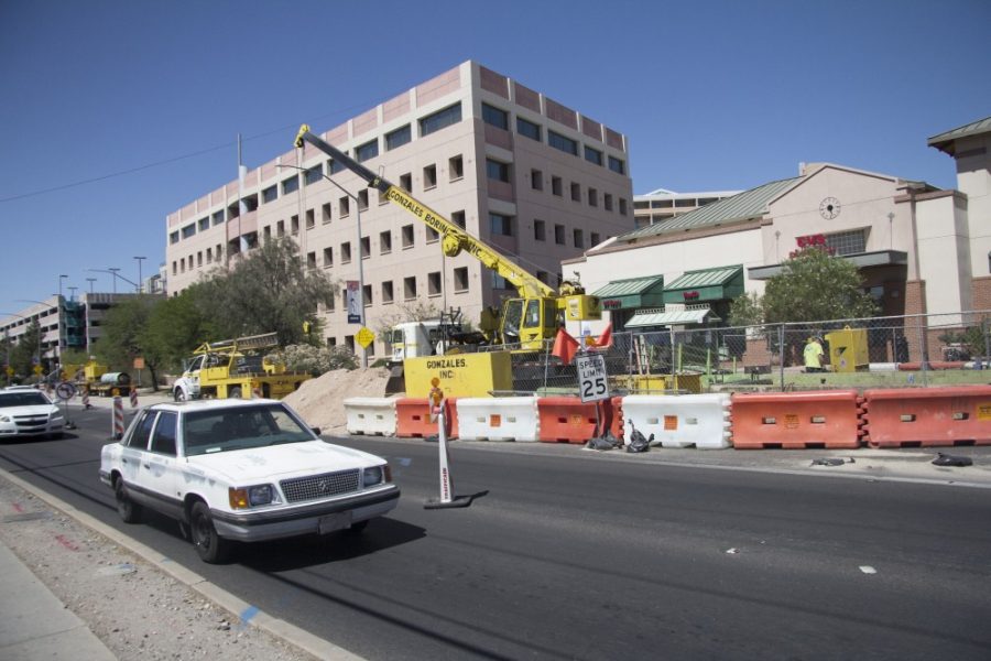 A white car passes the construction between 2nd St and University Blvd on Jun 1. 