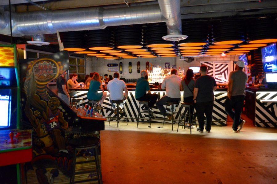 Patrons of the original Cobra Arcade Bar in downtown Phoenix enjoy drinks along along with classic arcade games.