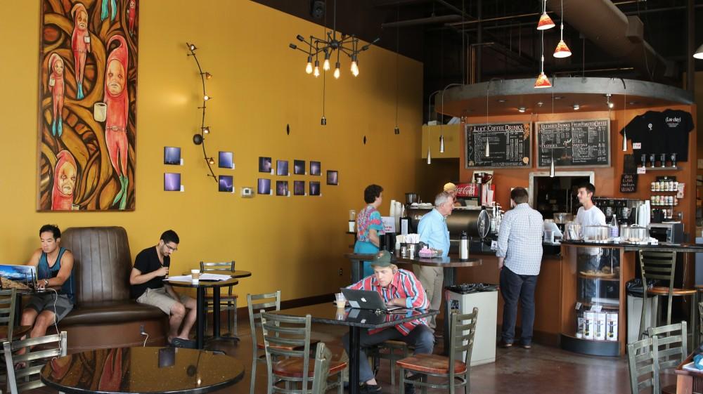 Customers inside of Caffe Luce, a local Tucson coffee shop located on Park Avenue north of University Boulevard. The cafe displays a variety art and offers many drinks including coffee, tea and Italian sodas.
