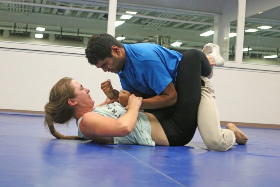 Kaleigh+Chabra%2C+left%2C+and+Shravan+Aras%2C+right%2C+practice+grappling+during+their+Krav+Maga+class+at+the+Bear+Down+Weight+Room.+Krav+Maga%2C+originally+designed+for+the+Israeli+military%2C+is+a+martial+art+form+that+concentrates+on+defense+and+de-escalation.