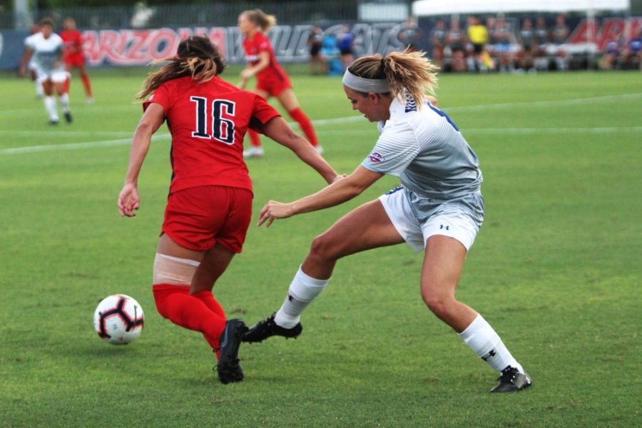 Sabrina Enciso, 16, evades the Houston Baptist forward during the Houston Baptist vs Arizona soccer game at the Mulcahy Stadium on Sunday. Enciso scored the third goal of the first half with a volley from the middle of the 18th.