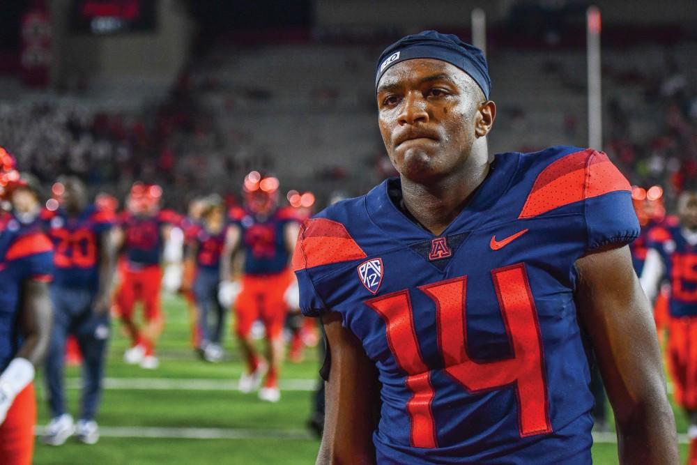  Arizona quaterback Khalil Tate walks off the field after the UA-Houston game on Sept. 9 at Arizona Stadium. Tate looks to take over his first full season as the starter after taking over from Brandon Dawkins midway through the 2017 season. 