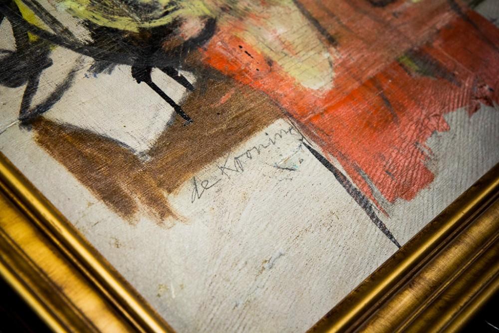 Willem de Kooning's "Woman-Ochre" being handled upon its return to UAMA August 2017. The painting is valued at approximately $100 million, according to Curator of Exhibitions Olivia Miller. 