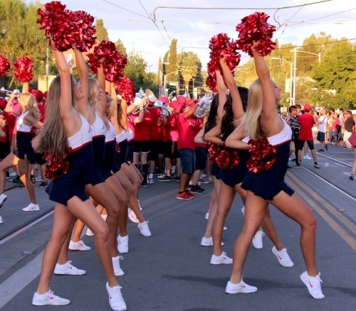 The Pride of Arizona pom line dances during Bear Down Friday on University Boulevard. 