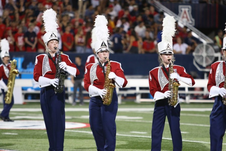 The Pride of Arizona Marching Band performs in Arizona Stadium.