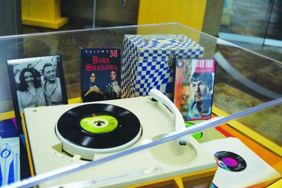 A record player with records and various movies and games on display at the 1968 in America special collections exhibit at the University of Arizona. The exhibit is meant to pay tribute to the atmosphere of Tucson during 1968, as well as the rest of America.