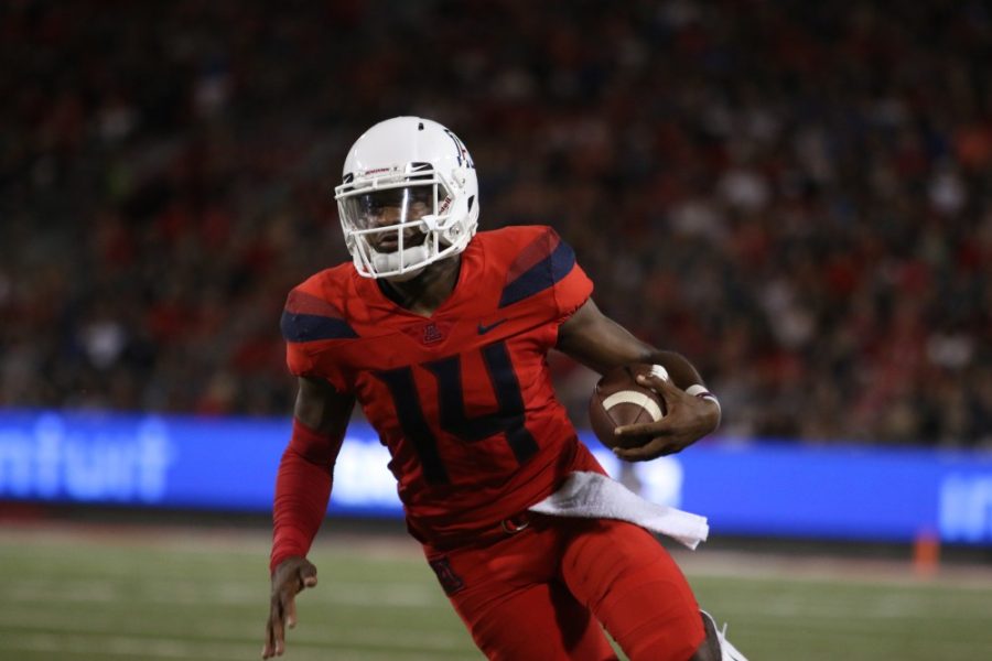 Khalil+Tate+runs+the+ball+in+during+the+2nd+half+of+the+game+against+BYU.+Khalili+Tate+is+known+to+run+the+ball+when+there+is+no+opening+to+past.+