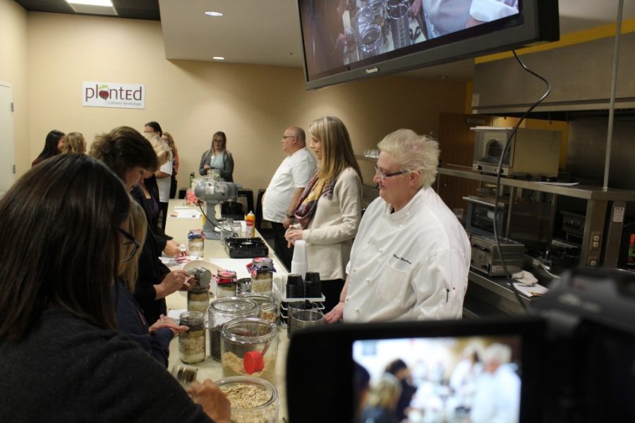 Volunteers and participants in the PlantED Culinary Workshop in 2017 work to prepare food. The workshop is hosted by Arizona Student Unions and is in its second year.