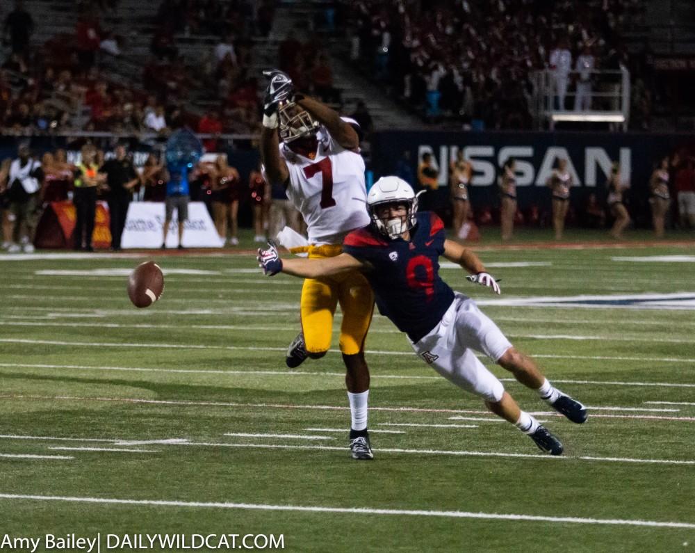 Wildcat Tony Ellison (9) dives to catch the incoming throw during the fourth quater of the Arizona-USC game at the Arizona Stadium on Saturday September 29, 2018 in Tucson, Az.