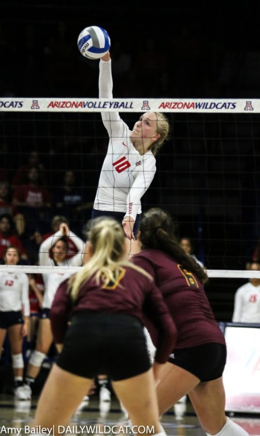 Arizona outside hitter Paige Whipple strikes the ball to ASU in the Arizona versus Arizona State game in McKale Center on Sept. 20, 2018, in Tucson, Az. The Wildcats beat ASU 3-0.