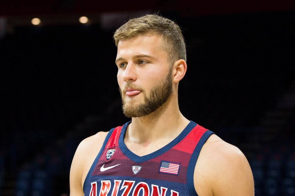 Arizona's Ryan Luther thinks about how to answer a question given to him during the UA basketball media day on Monday, Oct. 1 at McKale Center in Tucson, Ariz.