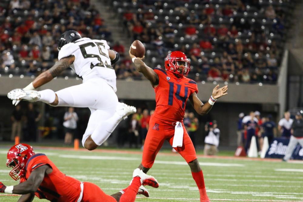 Quarterback Khalil Tate (14) passes the ball during the homecoming game against Oregon on Saturday, Oct. 27 at Arizona Stadium. Oregon was upset by Arizona with a final score of 44-15. 