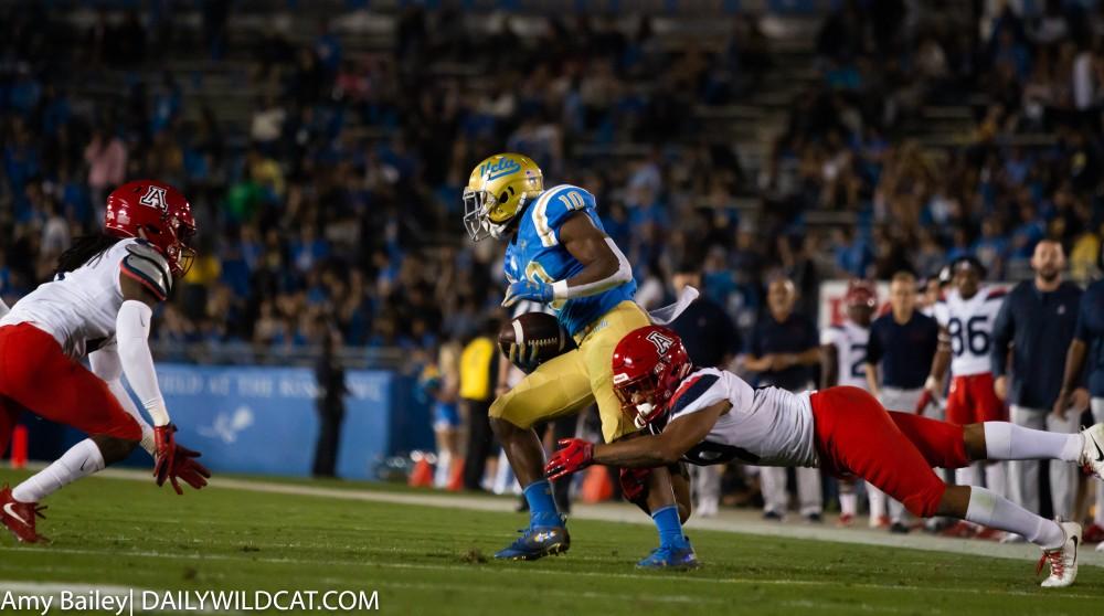 Arizona's Scottie Young Jr. (19) tackles UCLA player in the first quarter of the Arizona-UCLA game at Spieker Field on Oct. 20, 2018 at the Rose Bowl in Pasadena, CA.