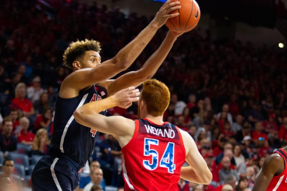 Center/forward Chase Jeter (4) jumps to catch the ball during the red blue game on Sunday, Oct 14 at Mckale Center. The red team beat the blue team 39-33. 