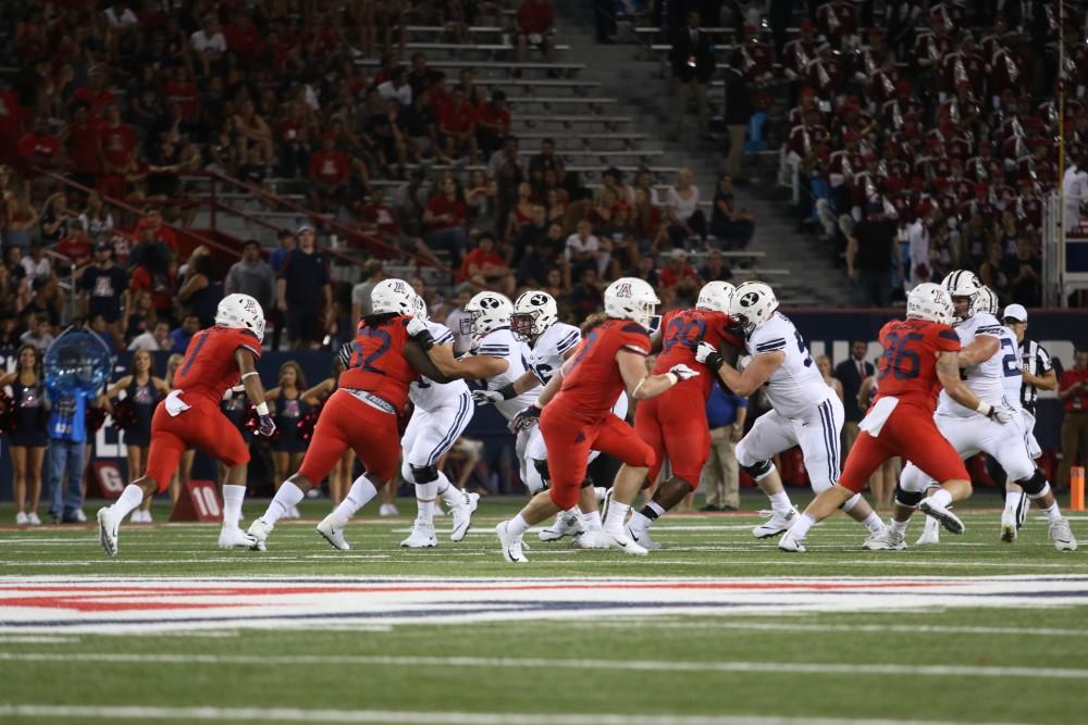 The Arizona defense attempts to stop the BYU offense during the UA-BYU football game on Sept. 1, 2018 at Arizona Stadium in Tucson, Ariz.