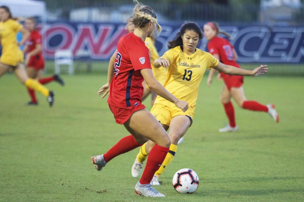 Arizona's senior midfielder Kennedy Kieneker passes the ball to her teammate during the game against Berkeley on October 13 at Mulcahy Stadium. The final score was a 3-3 tie. 