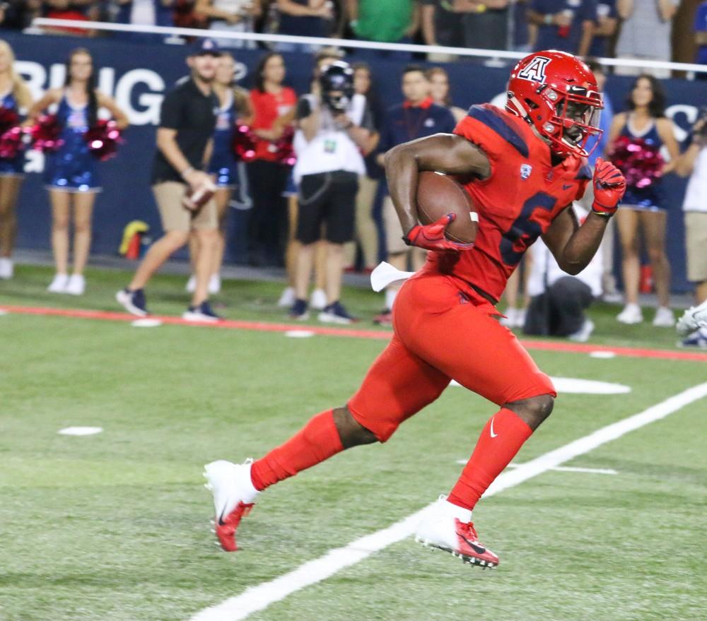 Receiver Shun Brown (6) sprints down the field after receiving the ball from Tate during the homecoming game against Oregon on Saturday, Oct. 27 at Arizona Stadium. Arizon got a victory over the cats with a final score of 44-15. 