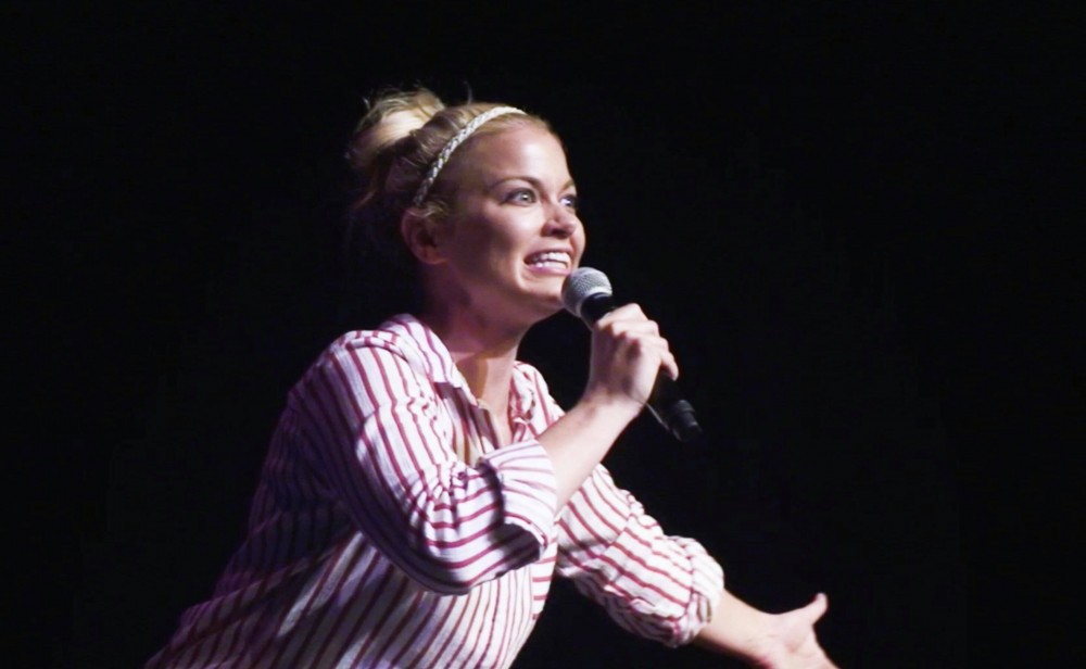University of Arizona Alumna Aubree Sweeney, a graduate from 2011, on the stage doing a comedy routine. Sweeney, based out of Los Angeles, does lots of traveling on the road as she goes on comedy tours and prepares for performances. 