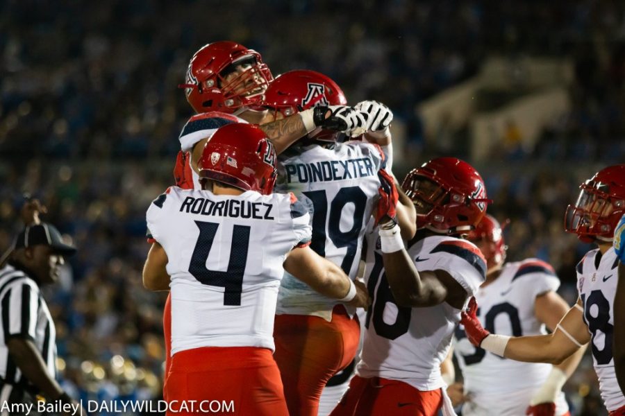 Wildcats+cheer+on+Shawn+Poindexter+%2819%29+for+score+a+touchdown+during+the+third+quarter+of+the+Arizona-UCLA+game+at+Spieker+Field+on+Oct.+20%2C+2018+at+the+Rose+Bowl+in+Pasadena%2C+CA.+The+game+ended+with+the+Wildcats+losing+31-30