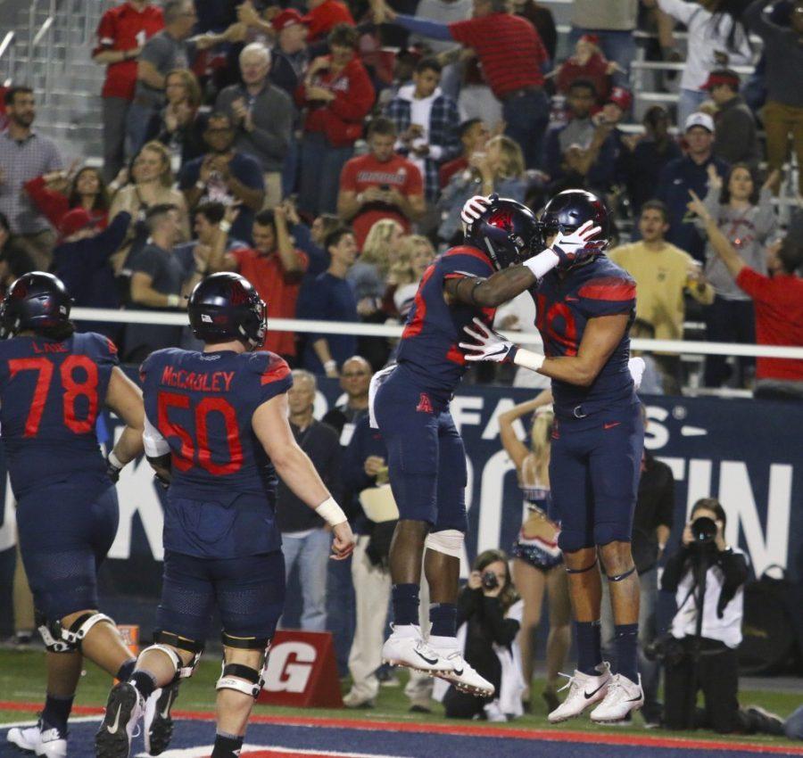 Arizona wide receiver Shawn Poindexter (19) and defensive tackle Nahe Sulunga (58)  celebrating a  touchdown during the second quarter of the Arizona vs. Colorado game on Friday November 2, 2018. Wildcats lead 26-24 at halftime.