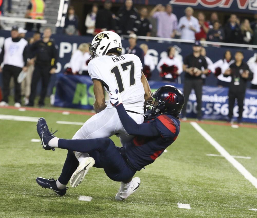Arizona cornerback Azizi Hearn (20) tackling Colorado wide receiver Kabion Ento (17) during the fourth quarter of the Arizona vs. Colorado game on Friday November 2, 2018. Wildcats win the game with a score of 42-34.