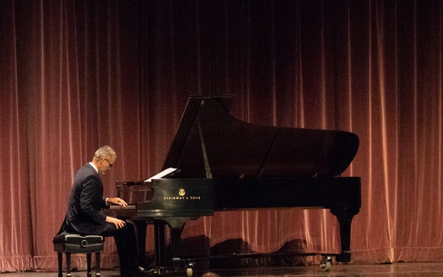John Milbauer, a professor at the school of music, plays a classical piece on the piano, as part of the Henry Koffler Tribute on Nov. 19 in Crowder Hall. Koffler is the only alumnus president and he expanded many programs in the school during his 9 years. 