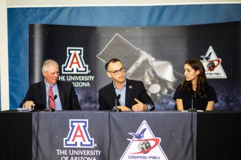 (left to right) University of Arizona President Robert Robbins, Dante Lauretta, and student Keara Burke hold a press conference about OSIRIS-REx on Monday in the Stevie Eller Dance Theatre.