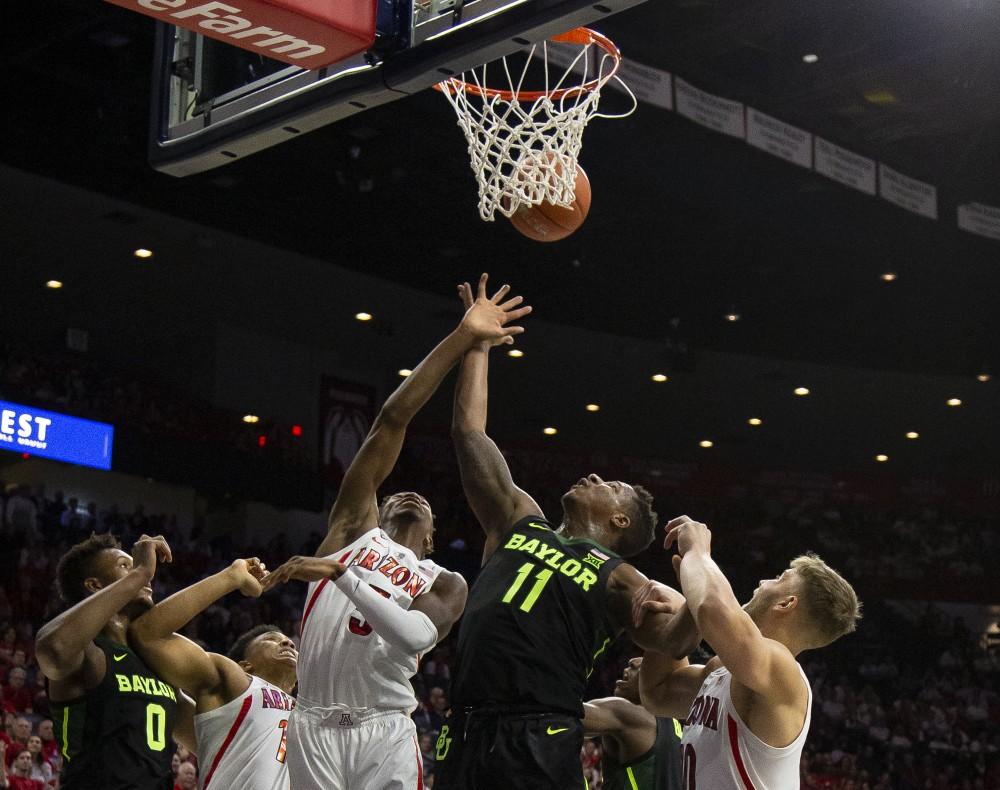The Arizona Wildcats and Baylor Bears fight for the rebound during the Arizona-Baylor game on Saturday, Dec. 15 at the McKale Center in Tucson, Ariz.