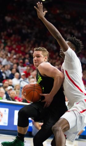 Guard Dylan Smith pressures a Baylor player during the game on Saturday, Dec. 15 at McKale Center. Arizona was defeated 58-49.