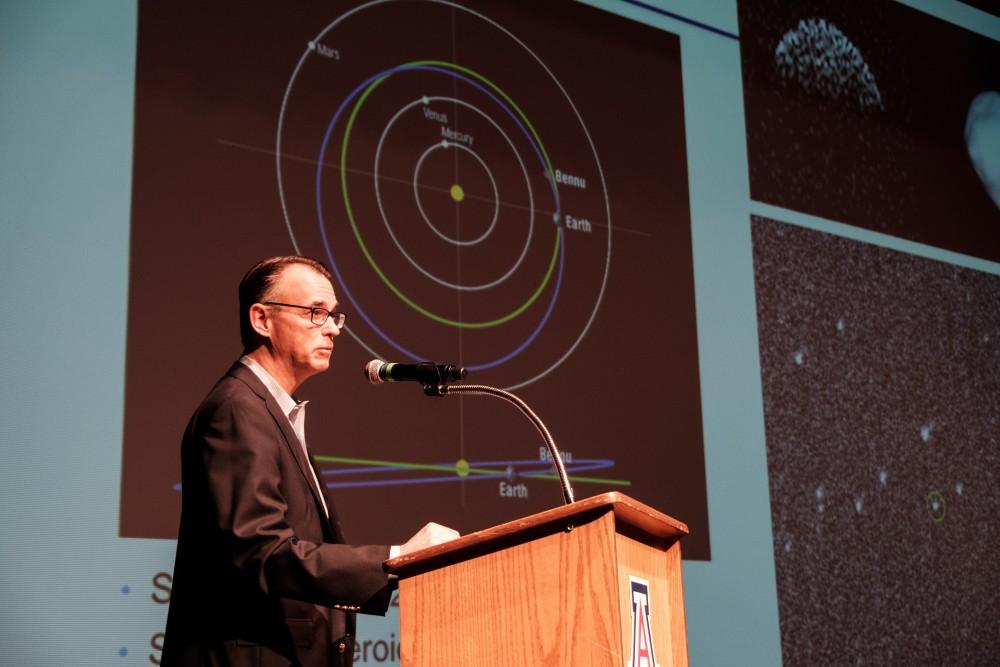 Dante Lauretta speaks on the origin's of the OSIRIS-REx mission's purpose on Monday at the Stevie Eller Dance Theatre. The mission is set to land on the near Earth asteroid Bennu and collect samples to bring back to Earth.