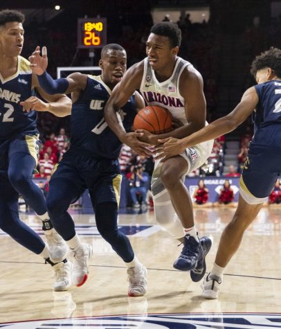 Arizona's Brandon Williams (2) pushes into the lane and gets fouled during the Arizona-UC Davis game on Saturday, Dec. 22, 2018 at the McKale Center in Tucson, Ariz.