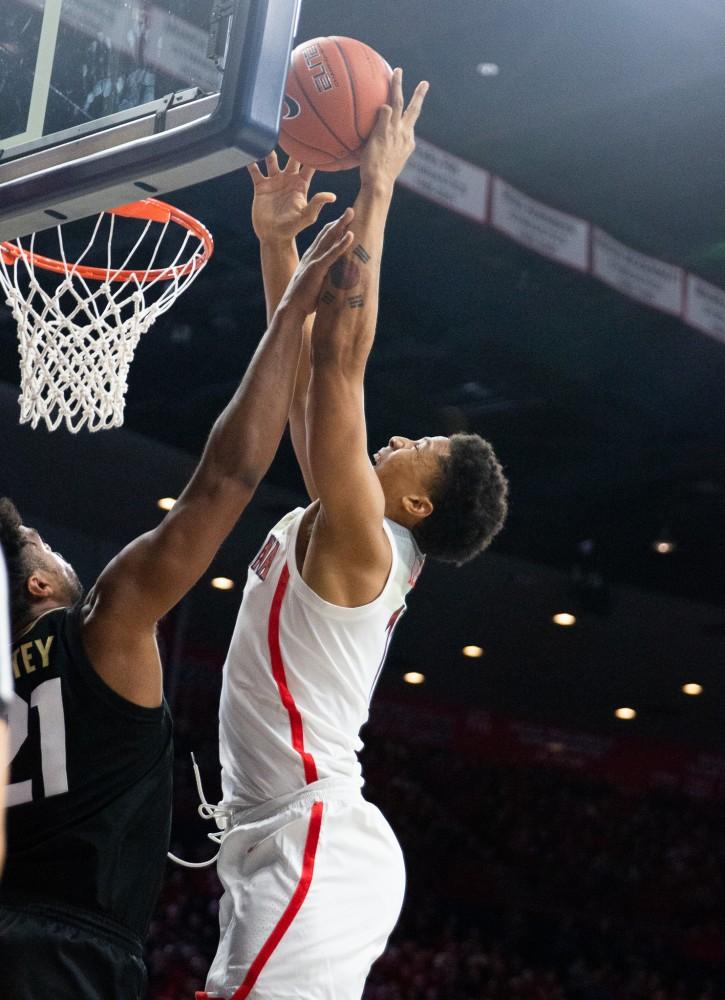 Forward Ira Lee (11) jumps to score a basket during the game against Colorado on Thursday, Jan. 3 at McKale Center. Arizona won the game 64-56. 
