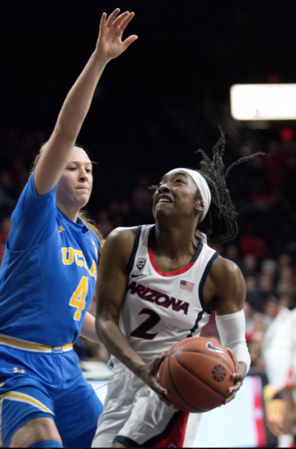  Aari McDonald (2) tries to get away from UCLAs defender during the Arizona-UCLA game on Sunday January 28, 2019 in the McKale Center.  The Wildcats lost 98-93. 