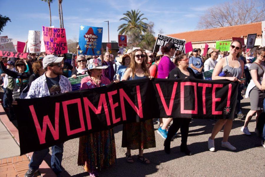 A+group+that+consisted+of+women+and+a+man+marching+during+the+Womens+march+in+Downtown+Tucson%2C+on+Jan.+20%2C+2019.+They+wanted+to+encourage+women+to+raise+their+voice+and+vote.