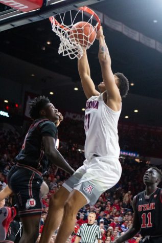 Forward Ira Lee (11) dunks the ball during the game against Utah on Saturday, Jan. 5 at McKale Center. Arizona won in overtime 84-81.