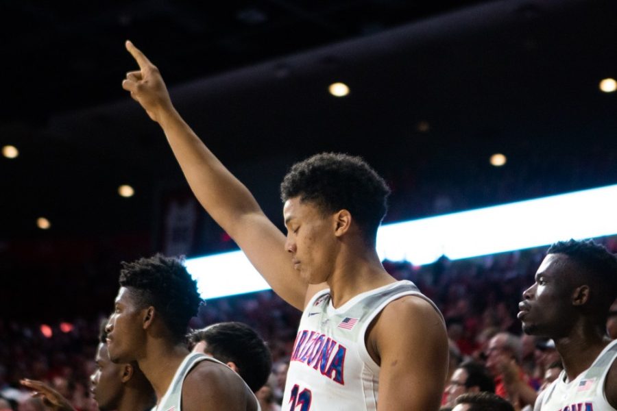 Ira Lee makes a gesture to celebrate his teammate scoring during the game against Utah on Saturday, Jan. 5 at McKale Center. Arizona won in overtime 84-81. 
