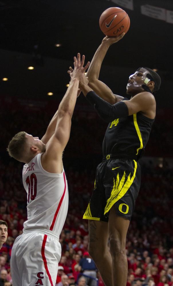 Arizona's Ryan Luther (10) goes up for the block against Oregon's Kenny Wooten (14) during the Arizona-Oregon game on Thursday, Jan. 17, 2019 at the McKale Center in Tucson, Ariz.