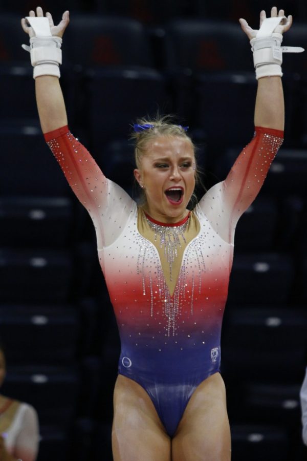 UA+gymnast+Danielle+Spencer+strikes+a+pose+after+completing+her+routine+on+the+uneven+bars+during+the+UA+v+California+meet+on+Jan.+26+in+McKale+Center.