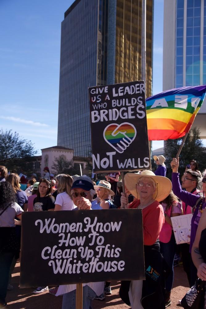 Two women showing their beautiful signs after the Women's march in Downtown Tucson, on Jan. 20, 2019. After the march, there were more guest speakers and performers to empower strong women. 