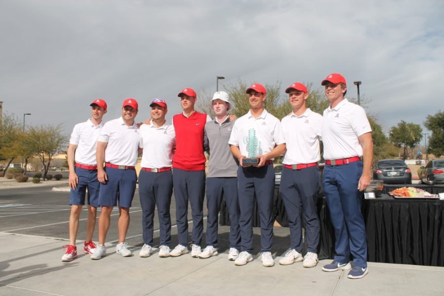 The Arizona mens golf team poses with the Arizona Intercollegiate trophy outside Sewailo Golf Club on Jan. 29, 2019. 
